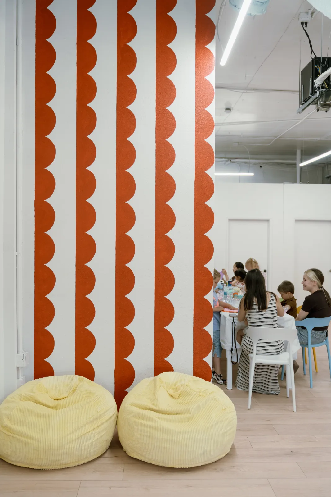 A birthday party under way at Lemur Lulu venue near Seattle, with the orange wall and bean bag corner