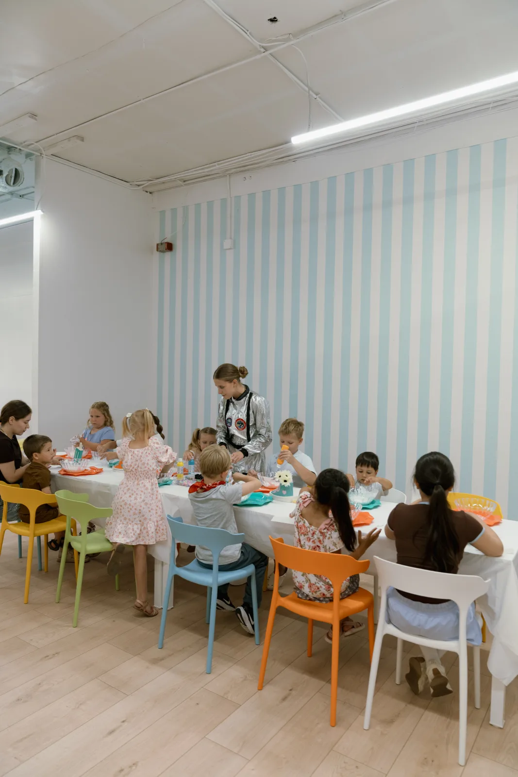 Guests seated along the workshop tables at Lemur Lulu kids party venue near Seattle